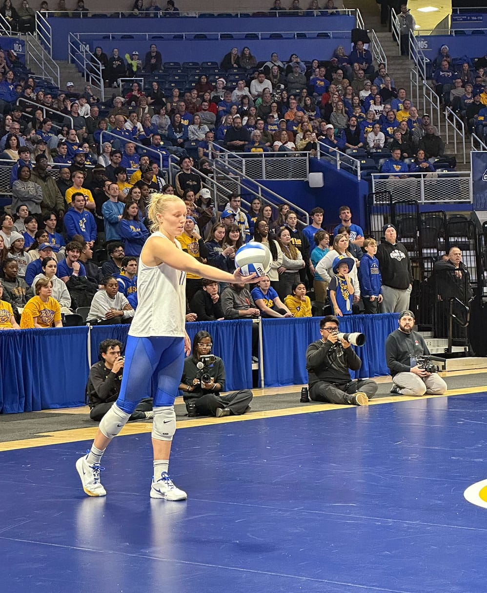 Brooke Mosher steadies herself before a jump topspin serve at the Petersen Events Center