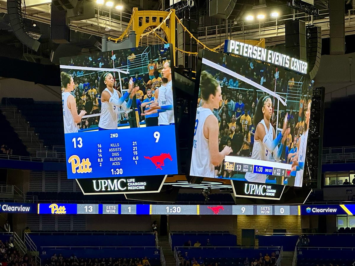 Photo shows the scoreboard at Petersen Events Center with Pitt leading SMU 13-9 in Set #2