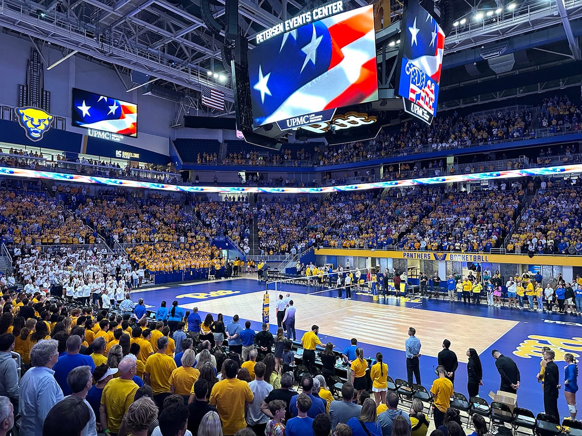 View of a packed Petersen Events Center standing up for the National Anthem prior to a 2024 match against Penn State