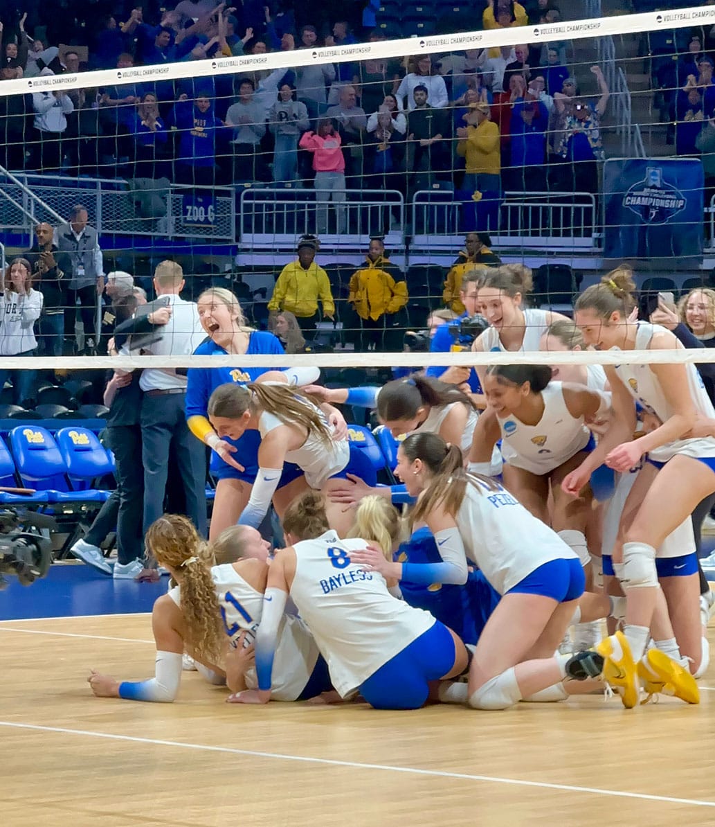Pitt players jump on Brooke Mosher to celebrate their victory in the Elite Eight