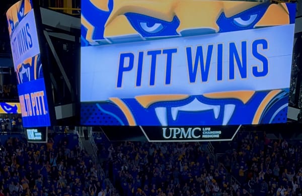 Scoreboard says PITT WINS with a big panther head logo