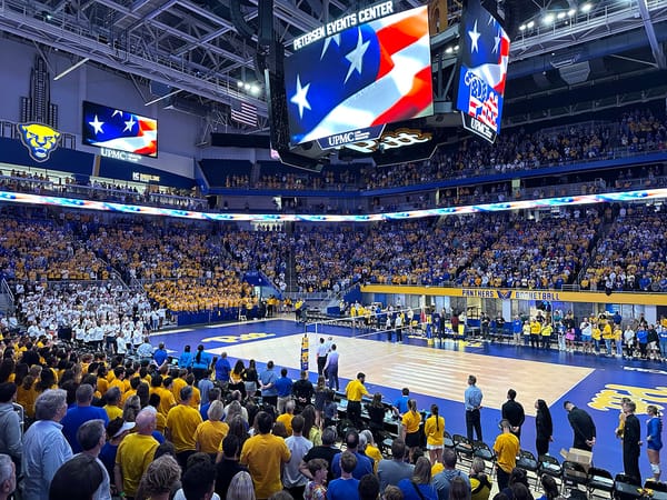 View of a packed Petersen Events Center standing up for the National Anthem prior to a 2024 match against Penn State